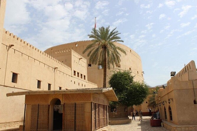 Amouage & Nizwa Full-Day Tour: Fort, Souq & Barakat Al Mouz - Nizwa Souq: fabrics, spices, silver, and real street energy