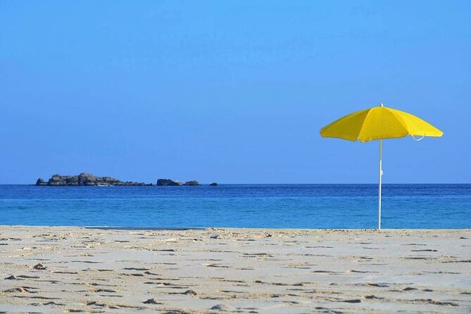 East and West Salalah Combination Private Full-day Tour - Al Fizayah Beach: Turquoise Water and White Sand on a Scenic Bend Road