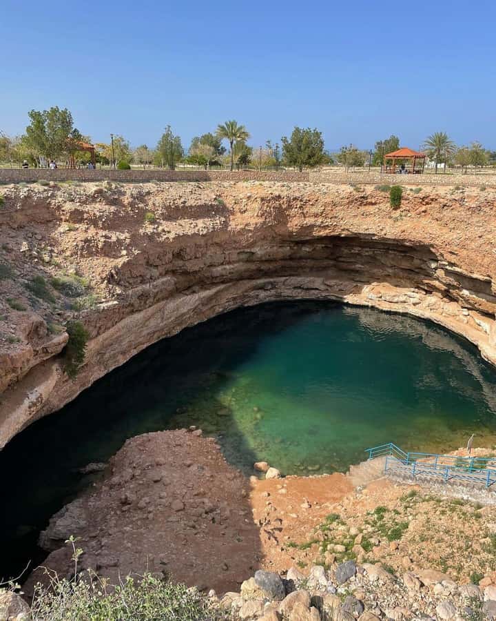 From Muscat:Private Wadi Shab and Bimmah SinkHole Tour - Bimmah Sinkhole: the sea-side crater near Hawiyat Najm Park