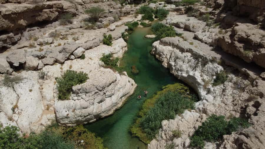 From Muscat: Wadi Shab & Bimmah Sinkhole Full-Day Tour - The Boat, the Canyons, and Why the Day Feels Like an Adventure