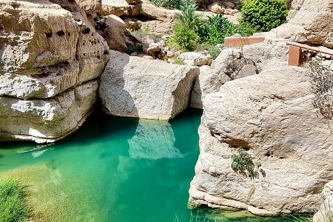 Full Day Tour in Wadi Shab - Bimmah Sinkhole: the crater pool for photos and a leg dip