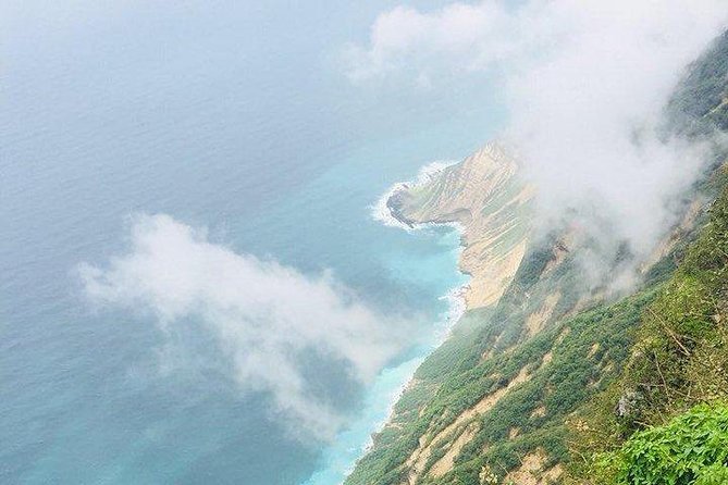 Full day west tour of Salalah - Al-Fezayeh Beach: Silver Sand, Clean Water, and Break Time