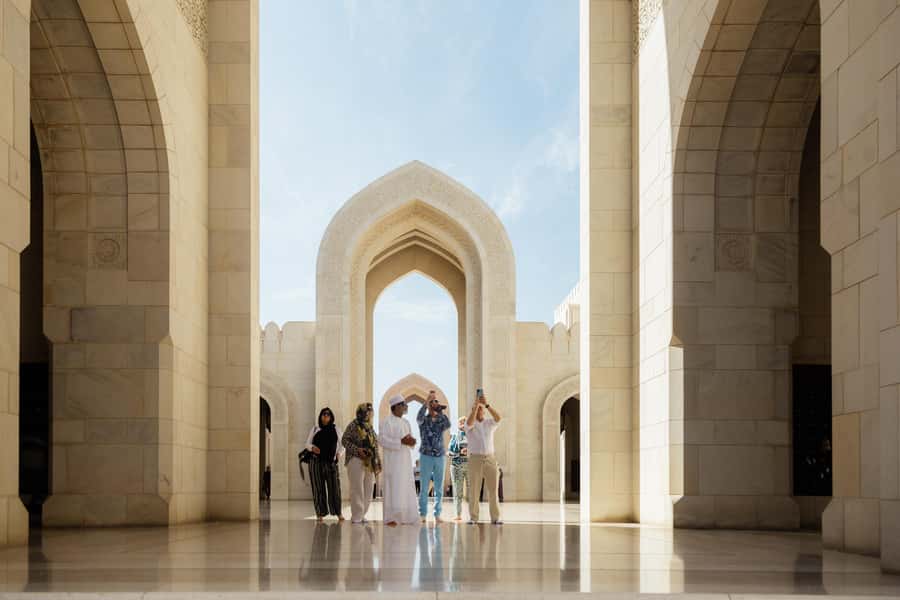 Guided Walking Tour of Sultan Qaboos Grand Mosque in Muscat - The marble courtyard and gardens: where the city noise fades