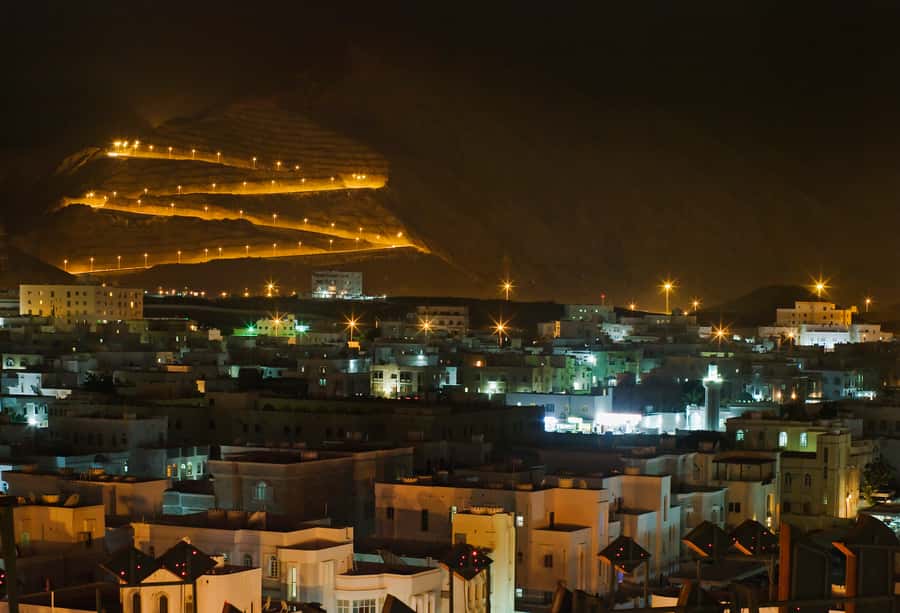 Muscat: Evening Guided City Highlights Tour by Van - Getting your bearings in Muscat after sunset