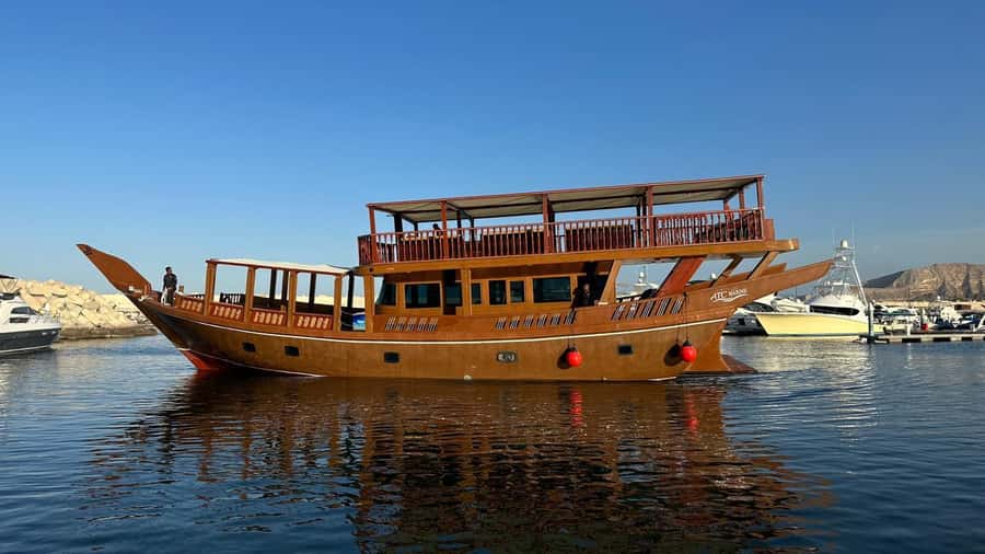 Muscat: Omani Traditional Dhow Sunset Cruise - On board perks: coffee, dates, snacks, and a real place to rest