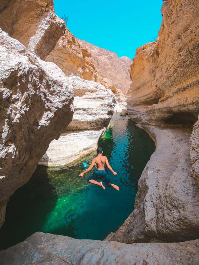 Muscat: Wadi Shab & Bimmah Sinkhole Tour with Pickup & Lunch - Getting to Wadi Shab: Parking, Boat Ride, and the Start of the Trail