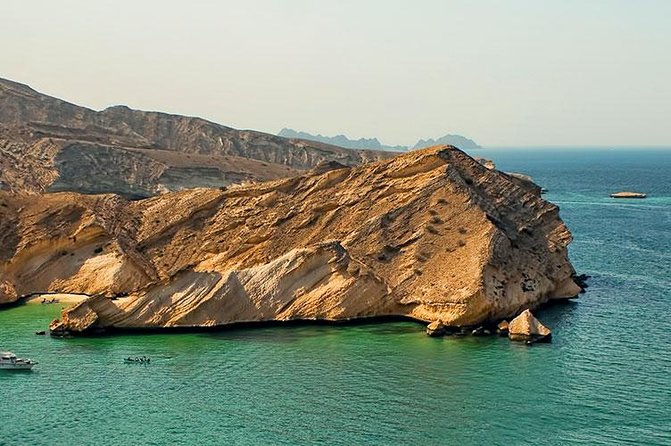 Omani dhow:Coastal and Sunset Cruise - Al Bustan Palace, Bandar Jassah, and the hotel coastline in twilight