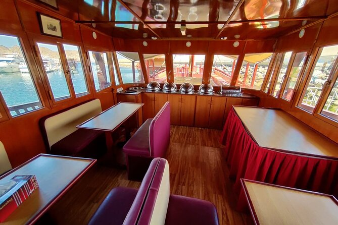 Omani Traditional Dhow Cruise: Sunset and Muscat Coastal View - Sailing by Al Bustan Palace Hotel: Oman hospitality seen from the sea