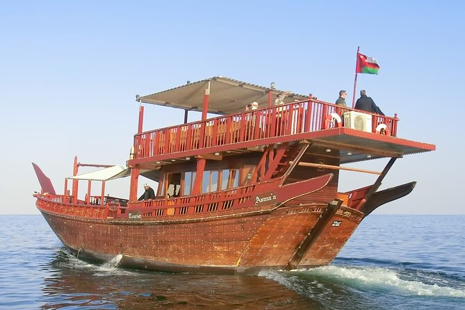 Omani Traditional Dhow Cruise: Sunset and Muscat Coastal View - The sunset moment: lights on board and the feel-good surprises