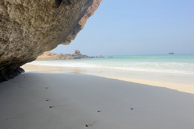 West Salalah Beaches and Blowholes - Fazayah Beach Trucking Way: sand, clear water, and a little rugged access